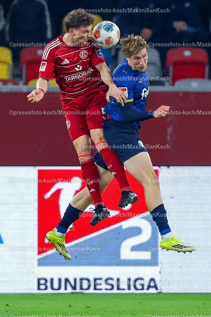 F9510042601125 | 10.04.2026, Fußball, Fortuna Düsseldorf - Holstein Kiel, 2. Fußball Bundesliga, Herren, Merkur Spiel-Arena, 29. Spieltag, Saison 2025 2026: Moritz Heyer&nbsp;(Fortuna Düsseldorf #05) im Zweikampf gegen  Lasse Rosenboom&nbsp; (Holstein Kiel #23) Kopfball Kopfballduell  DFB regulations prohibit any use of photographs as image sequences and or quasi-video.