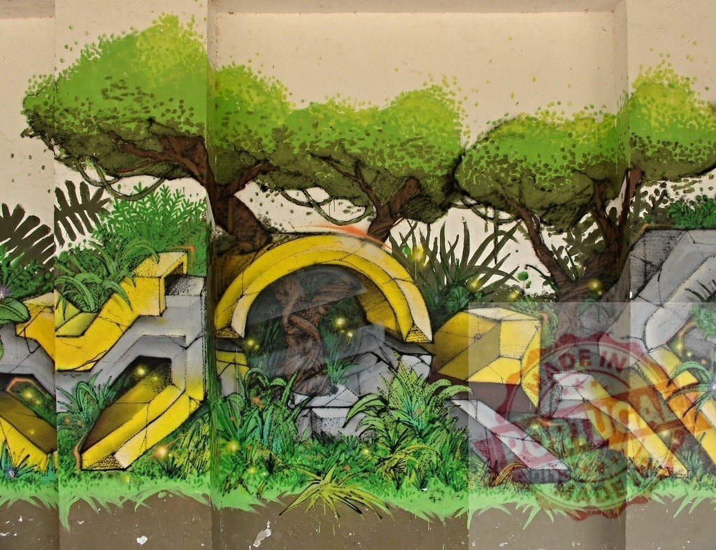 Urban jungle graffiti wall art with geometric shapes | Jungle-themed street art transforming an urban wall with vibrant colors and nature elements - Realisiert mit Pictrs.com