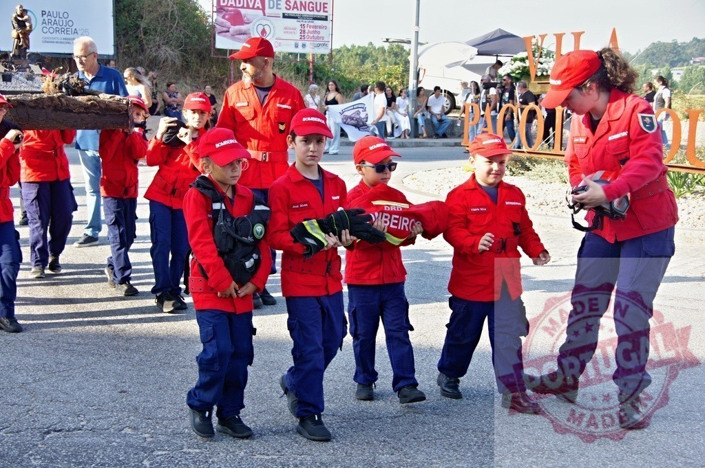 Young firefighters marching in parade, celebrating firemen patron saint, Saint Florian | Procession 15.08.2025 - Assumption Day - Paco de Sousa, Portugal Group of young firefighters marching in parade, celebrating firemen patron saint, Saint Florian - Realized with Pictrs.com