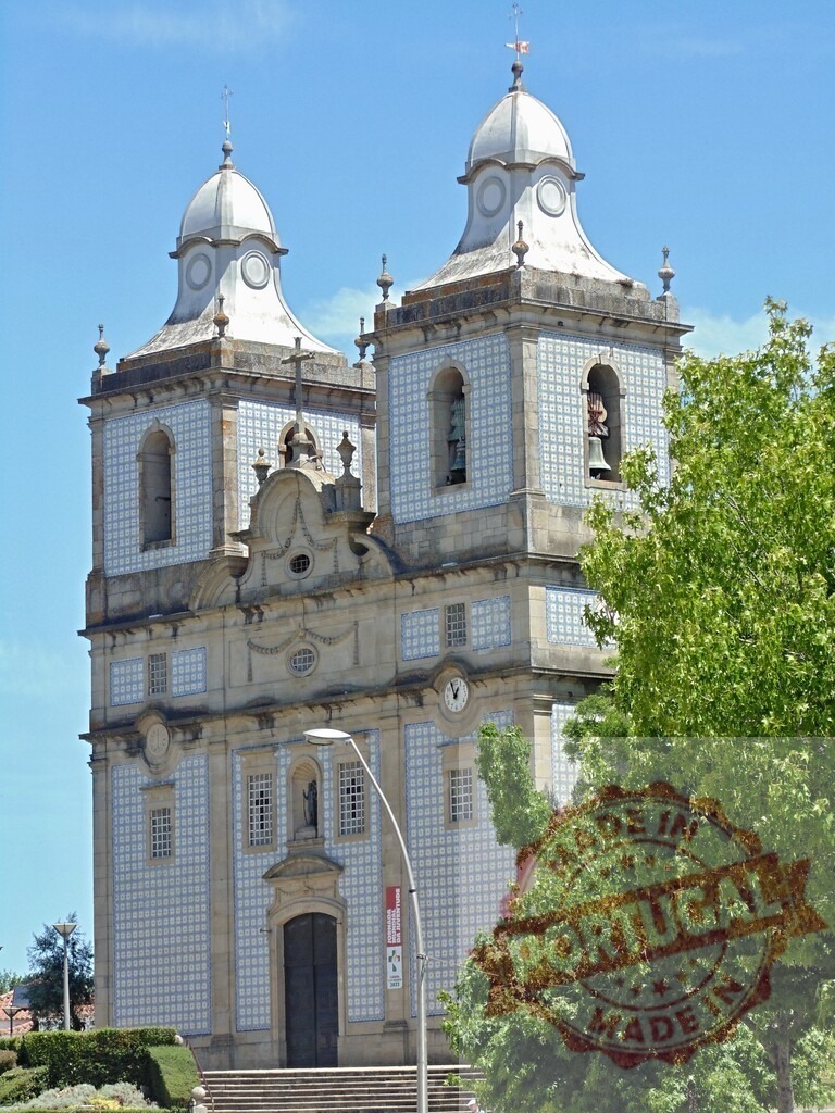 Igreja Matriz de Aveiro facade with azulejos in Portugal. Aveiro - Portugal | Main church in Aveiro featuring ornate azulejo tiles and twin bell towers against a blue sky - Realized with Pictrs.com