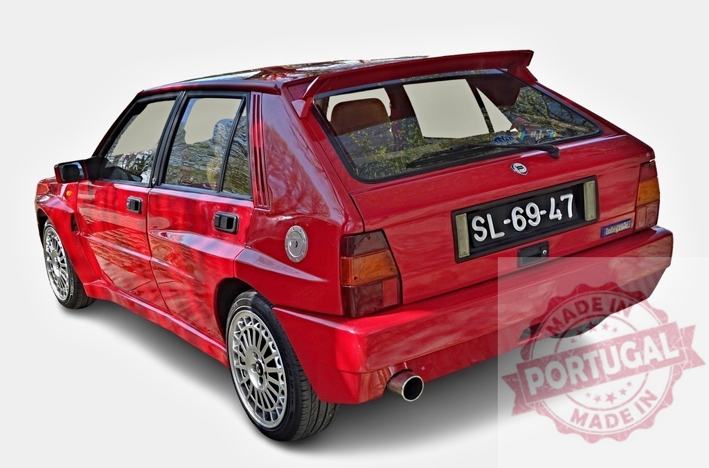 Red Lancia Delta Integrale evo showcasing its sporty design | Rear view of a red Lancia Delta Integrale evo parked, showing its sleek lines and sporty features - Realisiert mit Pictrs.com