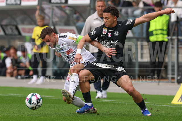 SK Puntigamer Sturm Graz vs TSV Egger Glas Hartberg – Championship Group    | Graz, Austria, 12.Apr.26 - SOCCER - ADMIRAL Bundesliga, SK Puntigamer Sturm Graz vs TSV Egger Glas Hartberg. The image shows Juergen Heil (Hartberg) and Jacob Peter Hoedl (STU).    