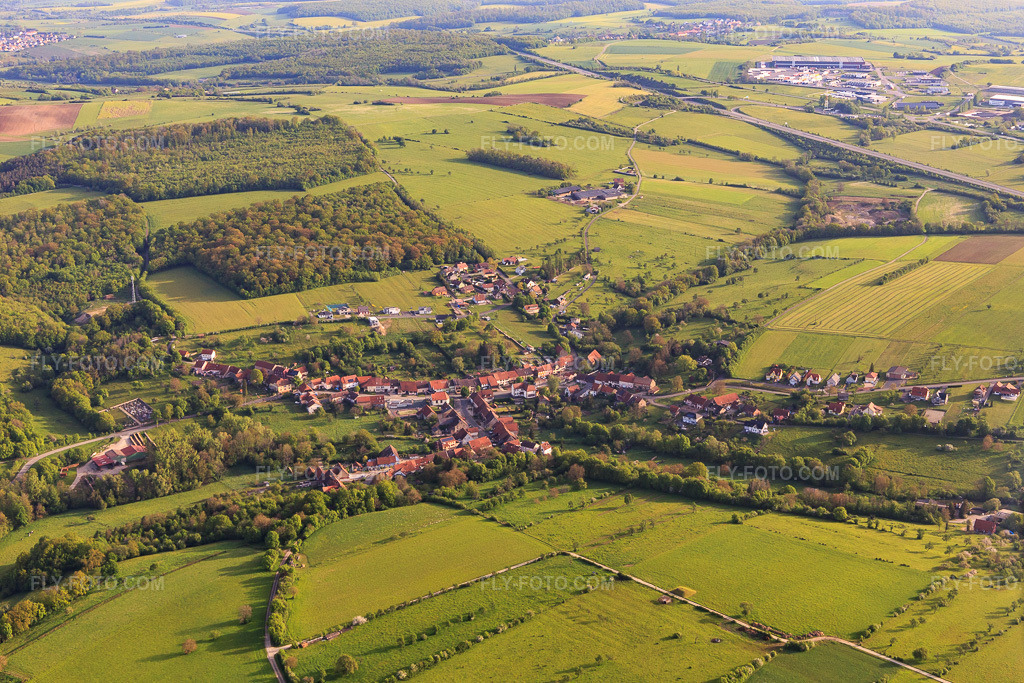 Aerial view: View of the town from the southwest in Burbach in the state Bas-Rhin, France. – Photo: IMG_140626.jpg taken on 05/01/2024 by Werner Riehm/FLY-FOTO.com – Resolution of the original: 5048 x 3365 px