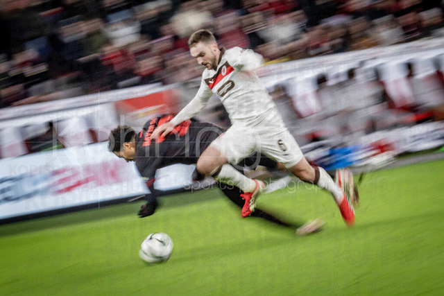 Bayer 04 Leverkusen vs. FC St. Pauli, 03.02.2026 | LEVERKUSEN, GERMANY - FEBRUARY 3:  James Sands (FC St. Pauli, 6) tackles Malik Tillman (Bayer 04 Leverkusen, 10) during the DFB Cup quarter-final match Bayer 04 Leverkusen vs. FC St. Pauli at BayArena on February 3, 2026 in Leverkusen, Germany. (Photo by Axel Kohring/Beautiful Sports Int.)DFL REGULATIONS PROHIBIT ANY USE OF PHOTOGRAPHS AS IMAGE SEQUENCES AND/OR QUASI-VIDEO.