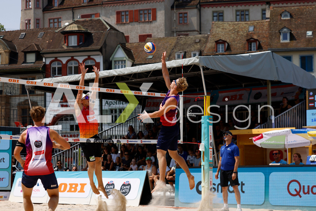 Obi BeachTour 2026 - Basel | BASEL, SWITZERLAND - JULY 19: MATHIS KÄLIN (SUI) attack / spike against LAURENZ LEITNER (AUT) block during the Obi BeachTour 2026 match between LEITNER / KINDL (AUT) and BREER / KÄLIN (SUI) at Barfüsserplatz on July 19, 2026 in Basel, Switzerland. - Realisiert mit Pictrs.com
