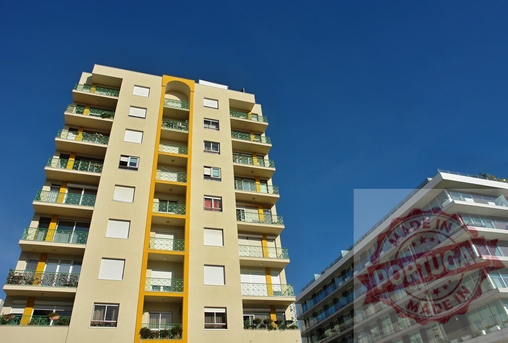 Modern city apartment buildings standing against clear blue sky | Urban residential buildings with balconies and modern facades reaching up to a bright sky - Realized with Pictrs.com