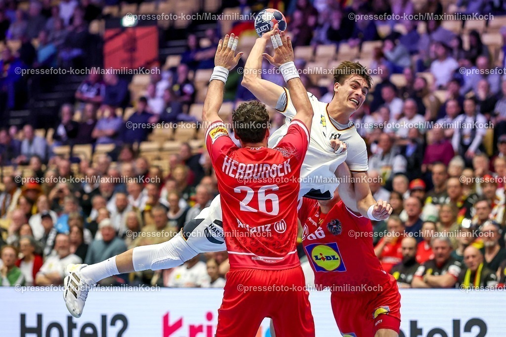 EHF15012602079 | 15.01.2026, Handball, Men's EHF EURO 2026, Deutschland - Östereich, Jyske Bank Boxen in Herning, Dänemark, Preliminary Round:  Lukas Herburger (Austria #26) im Zweikampf gegen   Julian Köster (Germany #18) 