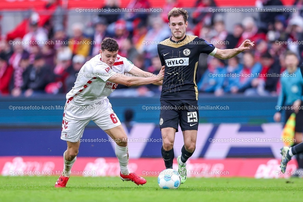 1FC25012501040 | 25.01.2025, Fußball, 1. FC Köln - SV 07 Elversberg, 2.. Fußball Bundesliga, 19. Spieltag, RheinEnergie-STADION, Saison 2024 2025: Eric Martel (FC Köln #6) im Zweikampf gegen Tom Zimmerschied (SV Elversberg #29) DFB regulations prohibit any use of photographs as image sequences and or quasi-video.