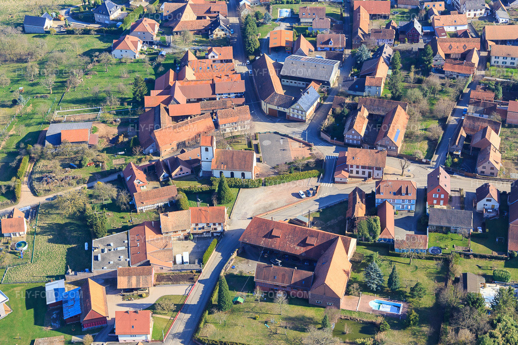 Aerial view: Protestant Lutheran Church of Rigendorf in Ringendorf in the state Bas-Rhin, France. – Photo: IMG_097522.jpg taken on 03/16/2017 by Werner Riehm/FLY-FOTO.com – Resolution of the original: 5190 x 3460 px