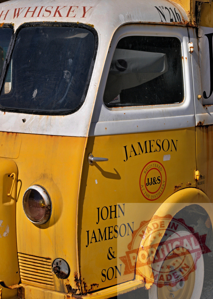 Weathered Jameson whiskey vintage delivery truck | Jameson whiskey lettering and logo on a weathered, yellow, rusty vintage delivery truck - Realized with Pictrs.com