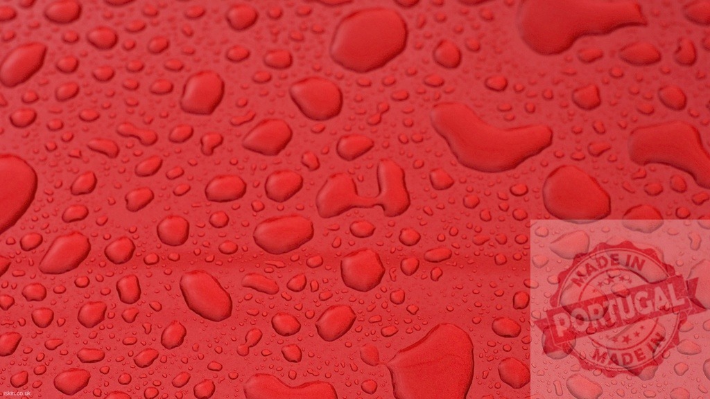 Water Droplets Resting on a Vibrant Red Surface | Close-up of water droplets beading on a smooth, red surface, creating a textured pattern - Realized with Pictrs.com