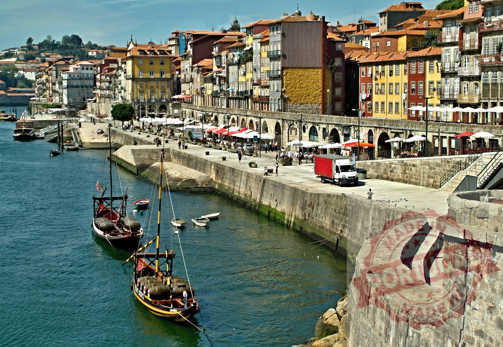 Ribeira waterfront Porto Portugal, Douro river rabelo boats | Ribeira waterfront along Douro river featuring traditional rabelo boats and historic buildings - Realized with Pictrs.com