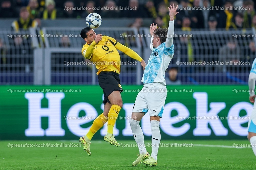 UCL10122501073 | 10.12.2025, Fußball, UEFA Champions League, Borussia Dortmund - FK Bodö/Glimt, BVB Stadion, 5. Spieltag, Saison 2025 2026: Ramy Bensebaini (BVB #05) Kopfball im Zweikampf gegen  Andreas Helmersen (Bodo Glimt #21) Regulations prohibit any use of photographs as image sequences and or quasi-video.