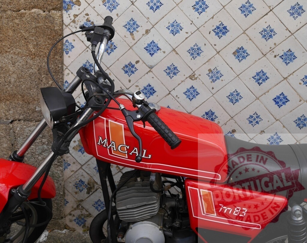 Red Macal Motorcycle Parked Against a Tiled Wall in Portugal | Classic red Macal motorbike parked against a wall with traditional Portuguese tiles - Realisiert mit Pictrs.com