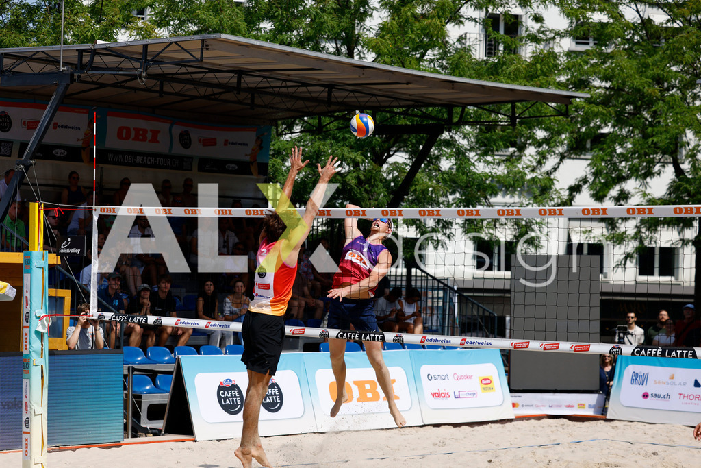Obi BeachTour 2026 - Basel | BASEL, SWITZERLAND - JULY 18: VILLADS FLÜGGE NAPIER (DEN) attack / spike against SIMON LEFFLER (SUI) during the Obi BeachTour 2026 match between ALLEMANN / LEFFLER (SUI) and MASSEREY / SCHNEGG (SUI) at Barfüsserplatz on July 18, 2026 in Basel, Switzerland. - Realisiert mit Pictrs.com