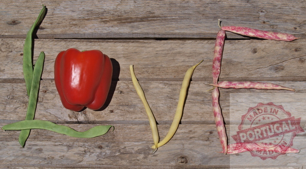 Love word formed by fresh organic garden vegetables | Fresh garden vegetables shaping the word love on a rustic wooden background - Realized with Pictrs.com