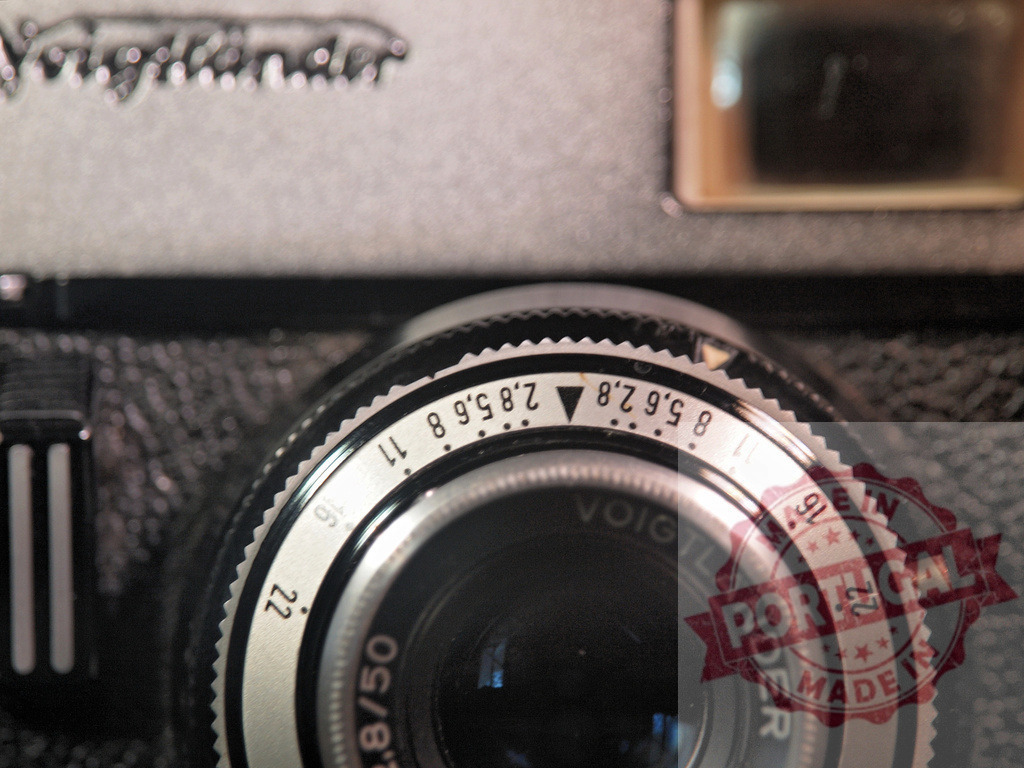 Voigtländer vintage camera lens with aperture settings | Voigtländer 2.8/50 lens showing aperture settings on a vintage analog camera body - Realized with Pictrs.com