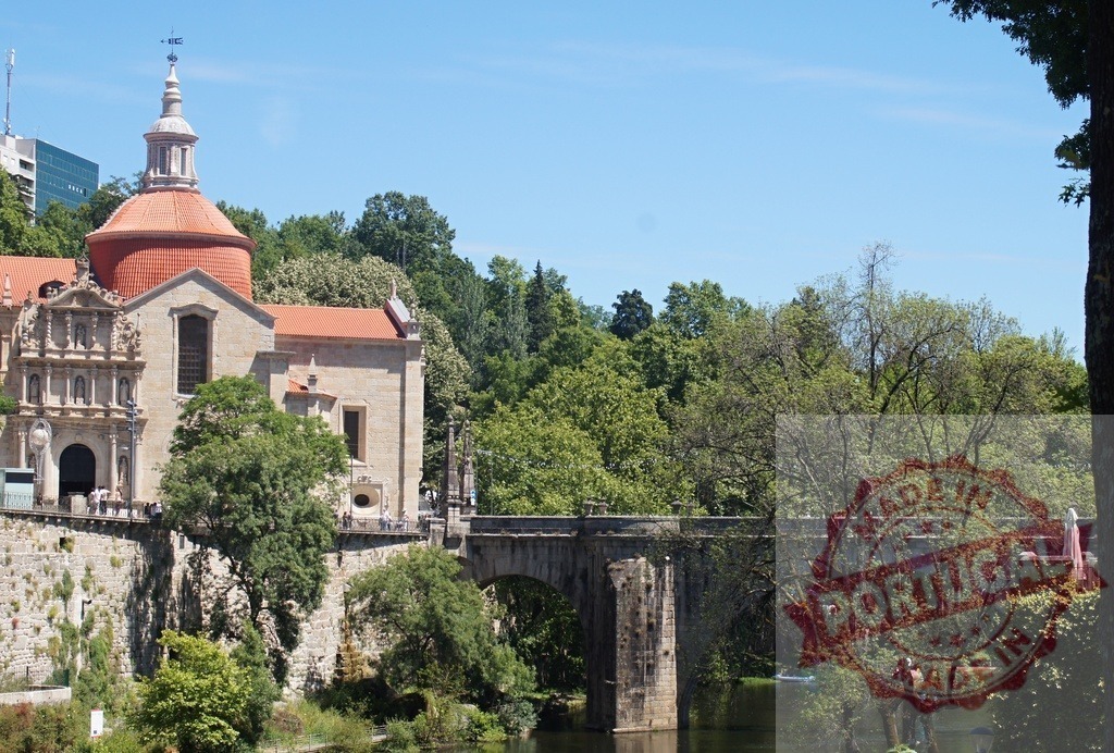 São Gonçalo Church and bridge spanning Tâmega River in Amarante | São Gonçalo Church with its distinctive dome standing next to the historic bridge over the Tâmega River - Realized with Pictrs.com