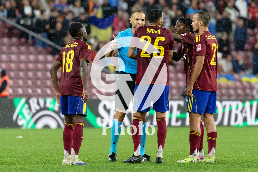 UEFA Conference League Play-offs 2nd leg - Servette FC v FC Shakhtar Donetsk | Dylan Bronn (25 Servette FC) speaks with Guillermo Cuadra Fernandez referee  during the UEFA Conference League Play-offs 2nd leg match between Servette FC and FC Shakhtar Donetsk at Stade de Geneve in Geneva, Switzerland