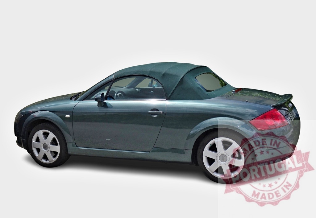 Green Audi TT roadster parked with closed soft top | Stylish green Audi TT roadster parked with closed soft top on white background - Realisiert mit Pictrs.com