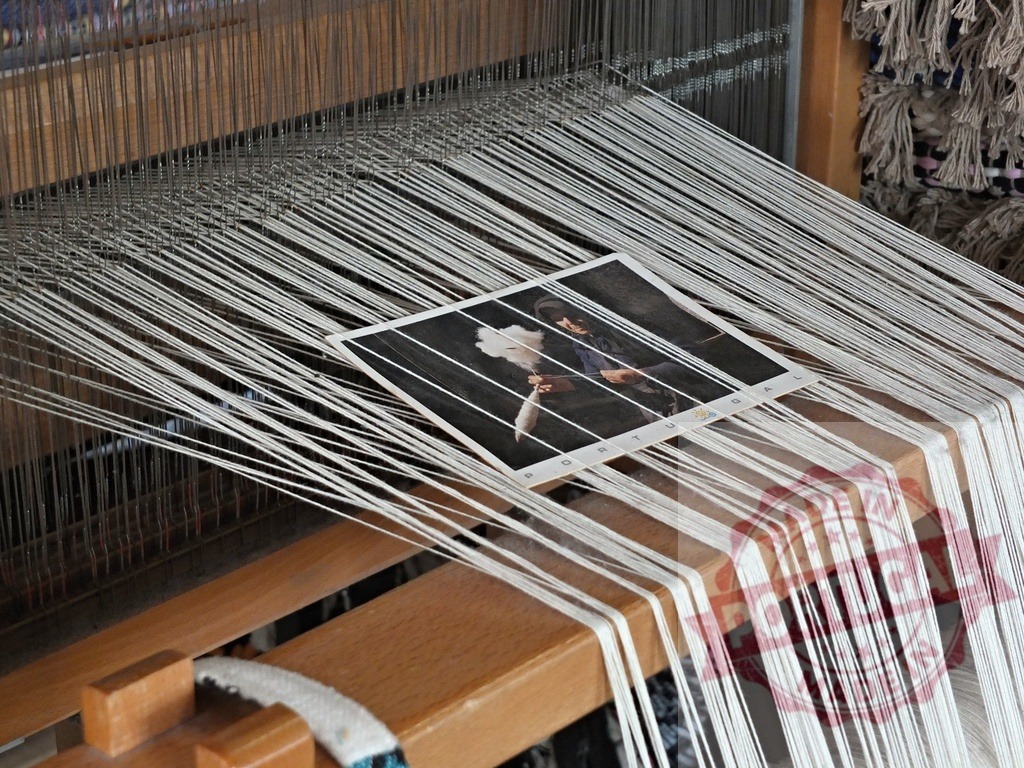 Traditional Portuguese loom weaving cotton threads with postcard | Weaving cotton threads on a traditional wooden loom with a souvenir postcard from Portugal - Realized with Pictrs.com