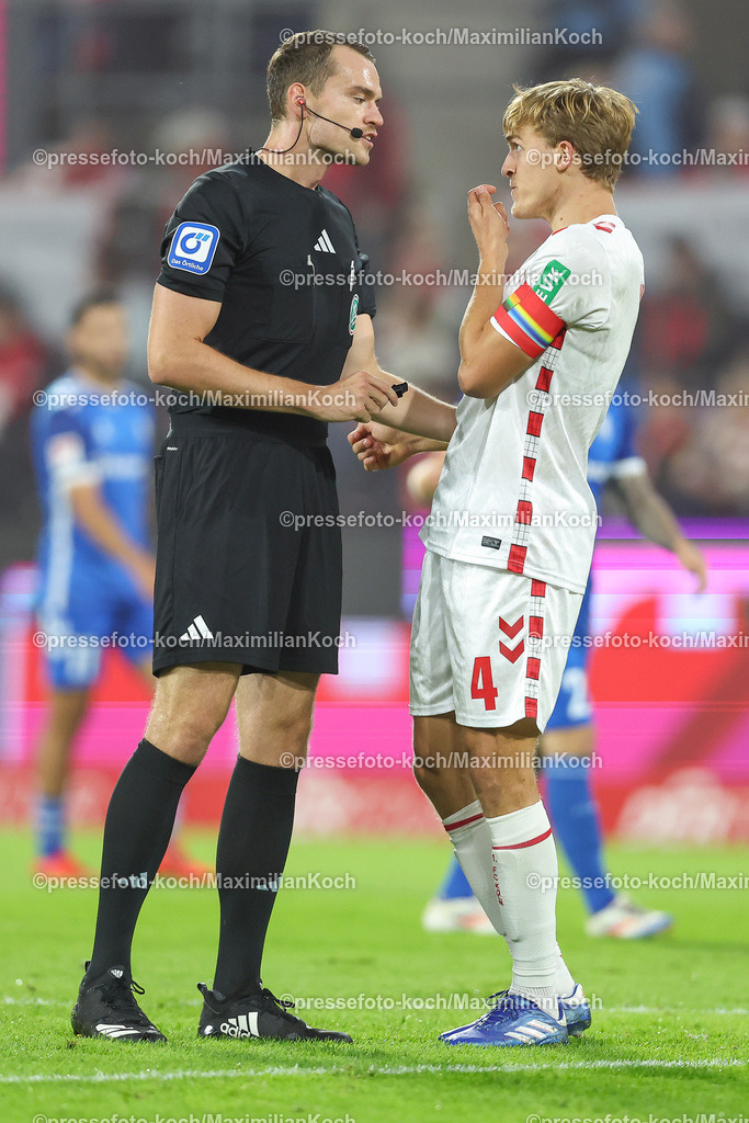 Koe14092402080 | 14.09.2024, 2. Fußball Bundesliga, 1. FC Köln - 1. FC Magdeburg, RheinEnergieSTADION, Saison 2024 2025: Timo Hübers (1.FC Köln #4) neben Schiedsrichter Richard Hempel (SR) DFB regulations prohibit any use of photographs as image sequences and or quasi-video.