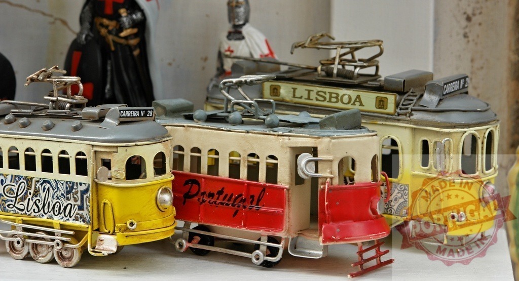 Vintage tin tram souvenirs from Lisbon Portugal | Three metal toy trams representing Lisbon's iconic transport - Realized with Pictrs.com