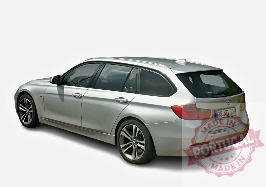 Silver BMW 3 series touring parked on white background | Modern silver BMW 3 series touring car parked on a white background in studio - Realized with Pictrs.com