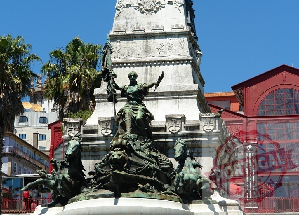 Monument to the Restorers in Restauradores Square, Lisbon. Porto - Portugal | Obelisk monument with bronze statues under a clear blue sky in Lisbon, Portugal - Realized with Pictrs.com
