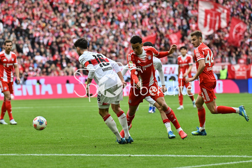 FC Bayern München - VfB Stuttgart | MUNICH, GERMANY - 19. APRIL: tackle between ATAKAN KARAZOR (VFB STUTTGART 16) and Jamal MUSIALA (FC Bayern Munich 10) during the Bundesliga Match between FC Bayern Munich vs. VfB Stuttgart at Matchday 30 at Allianz Arena / DFL REGULATIONS PROHIBIT ANY USE OF PHOTOGRAPHS AS IMAGE SEQUENCES AND/OR QUASI-VIDEO