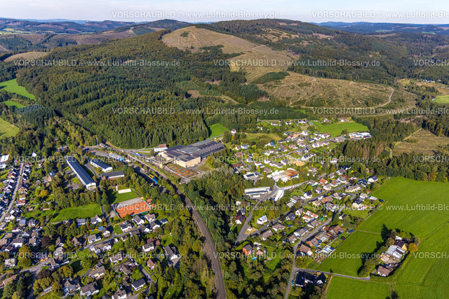 Kreuztal230911843 | Luftbild, Ortsansicht und Bahnhof im Ortsteil Littfeld, Eisenbau Krämer GmbH Werksgelände, Waldgebiet mit Waldschäden, Littfeld, Kreuztal, Siegerland, Nordrhein-Westfalen, Deutschland
