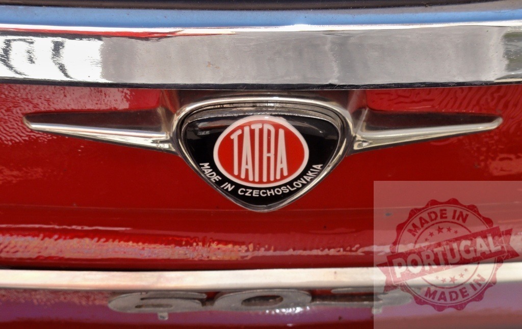 Tatra 603 logo shining on a red vintage car | Close-up of the Tatra logo on a red Tatra 603, showcasing the craftsmanship of this Czechoslovakian car manufacturer - Realized with Pictrs.com