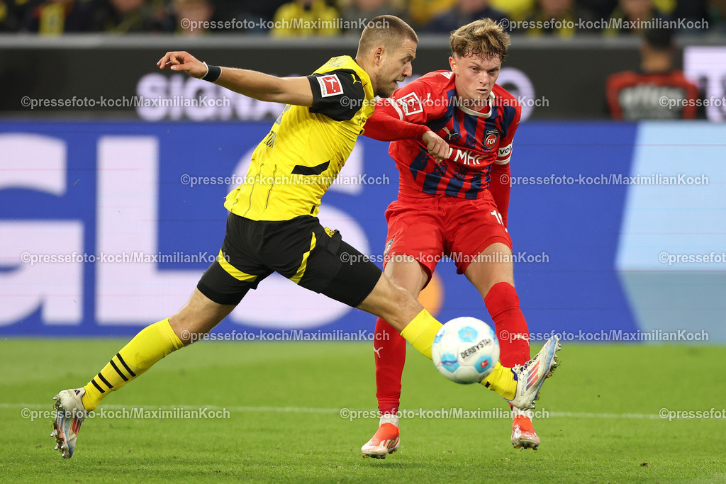 BVB13092402190 | 13.09.2024, 1. Fußball Bundesliga, Borussia Dortmund - 1. FC Heidenheim 1846, Signal Iduna Park, Saison 2024 2025: Waldemar Anton (BVB #3) verteidgt im Zweikampf gegen Paul Wanner (Heidenheim #10)DFB regulations prohibit any use of photographs as image sequences and or quasi-video.