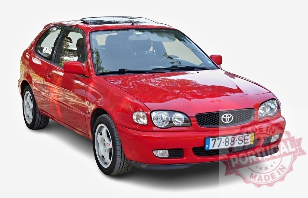 Red Toyota Corolla showing its front on white background | Tuning red Toyota Corolla with sunroof parked, showing its front, isolated on white background - Realized with Pictrs.com