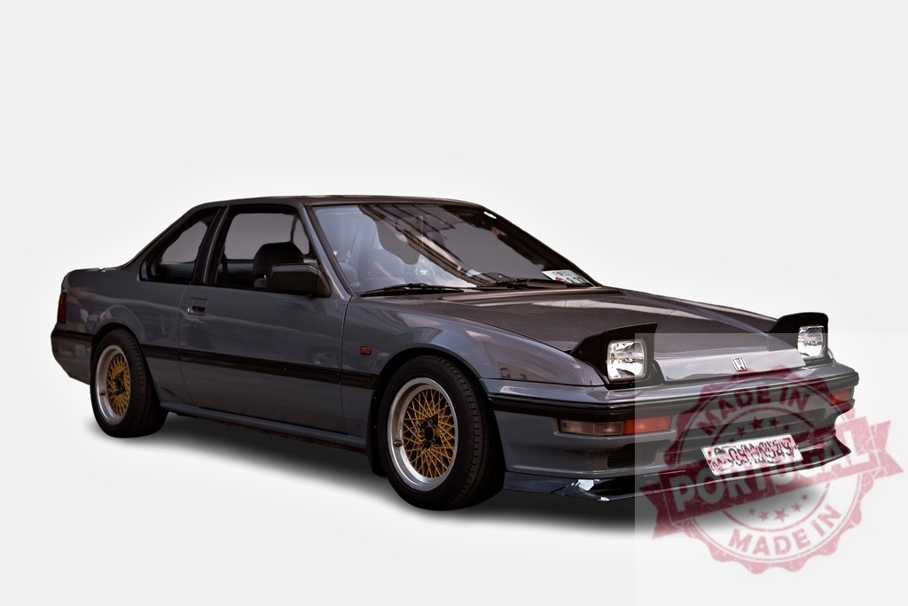 Honda Prelude showcasing its timeless design and sporty features | Grey Honda Prelude parked, highlighting its sleek lines and aftermarket modifications - Realisiert mit Pictrs.com