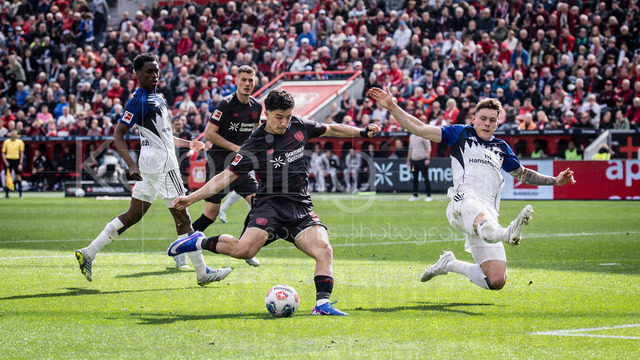 German Bundesliga, Bayer 04 Leverkusen vs. Hamburger SV, 16.05.2026 | LEVERKUSEN, GERMANY - MAY 16, 2026 :  Ibrahim Maza (Bayer 04 Leverkusen, 30), Nicolai Remberg (Hamburger SV, 21) during the German Bundesliga match on gameday 34 between Bayer 04 Leverkusen vs. Hamburger SV at BayArena on May 16, 2026 in Leverkusen, Germany. DFL REGULATIONS PROHIBIT ANY USE OF PHOTOGRAPHS AS IMAGE SEQUENCES AND/OR QUASI-VIDEO.