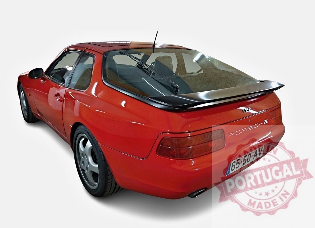 Red Porsche 968 sports car coupe on white background | Red Porsche 968 luxury sports coupe with spoiler on a clean white background - Realized with Pictrs.com