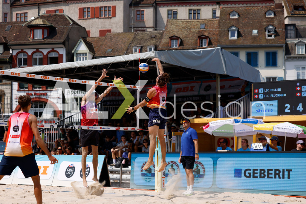 Obi BeachTour 2026 - Basel | BASEL, SWITZERLAND - JULY 19: LEO DILLIER (SUI) attack / spike against SIMON HAGENBUCH (SUI) block during the Obi BeachTour 2026 match between DILLIER / FLÜCKIGER (SUI) and HAGENBUCH / HAUSSENER (SUI) at Barfüsserplatz on July 19, 2026 in Basel, Switzerland. - Realisiert mit Pictrs.com