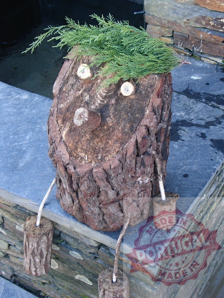 Wooden log character sitting and wearing a cedar wig | Funny wooden log character with cedar wig sitting on a stone wall - Realized with Pictrs.com