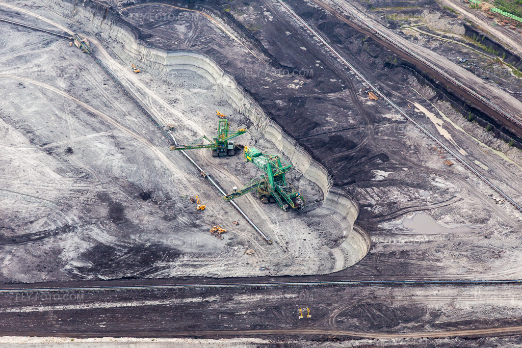 Aerial view: Conveyor excavator in the brown coal opencast mine 