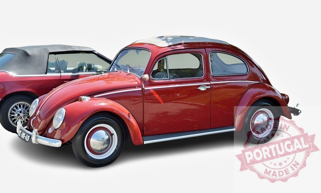 Classic Red Volkswagen Beetle Parked Next to Convertible | Vintage red Beetle parked beside a black convertible car - Realized with Pictrs.com