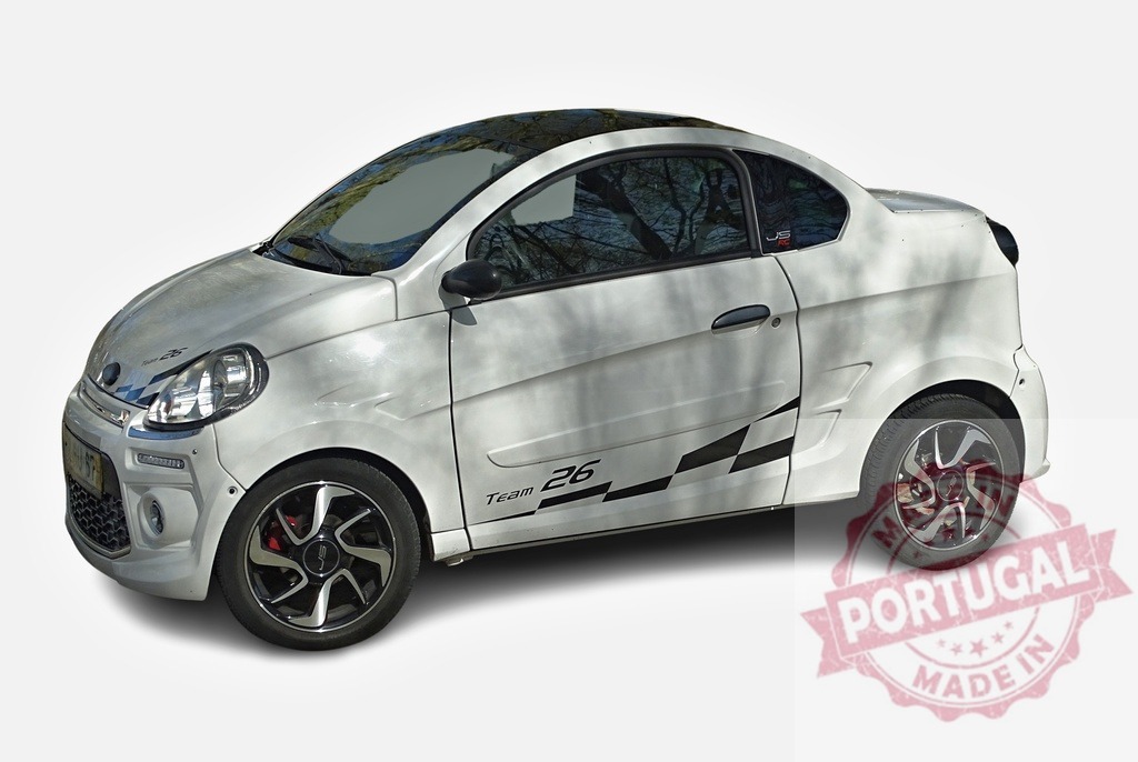 White Microcar Ligier JS50 Sport Ultimate posing in a studio | Studio shot of a white microcar Ligier JS50 Sport Ultimate with black rims and sporty stickers - Realized with Pictrs.com