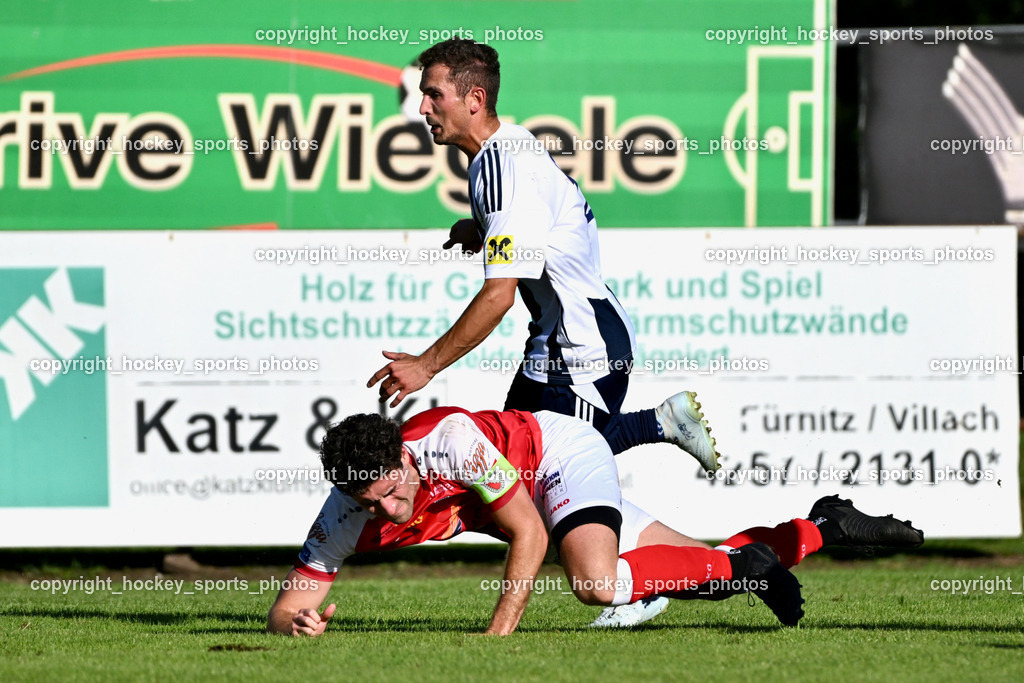 ATUS Nötsch vs. FC Dölsach | #21 Nicolas Francis Janschitz ATUS Nötsch, #12 Christian Brandstätter FC Dölsach, ATUS Nötsch vs. FC Dölsach, ATUS Nötsch vs. FC Dölsach am 23.08.2026 in Nötsch (Sportplatz Nötsch), Austria, (Photo by Bernd Stefan)