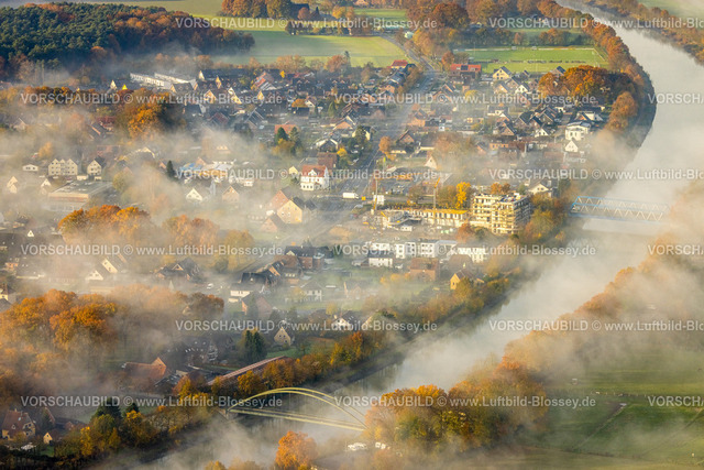 Haltern231104166 | Luftbild, Nebelschwaden über dem Ortsteil Bossendorf am Wesel-Datteln-Kanal mit Brücke, Baustelle und Neubau Katharinenhöfe Wohnquartier, umgeben von herbstlichen Laubbäumen, Bossendorf, Haltern am See, Ruhrgebiet, Münsterland, Nordrhein-Westfalen, Deutschland