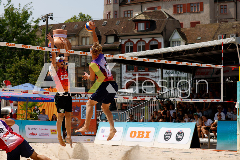 Obi BeachTour 2026 - Basel | BASEL, SWITZERLAND - JULY 19: MATHIS KÄLIN (SUI) attack / spike against LAURENZ LEITNER (AUT) block during the Obi BeachTour 2026 match between LEITNER / KINDL (AUT) and BREER / KÄLIN (SUI) at Barfüsserplatz on July 19, 2026 in Basel, Switzerland. - Realisiert mit Pictrs.com