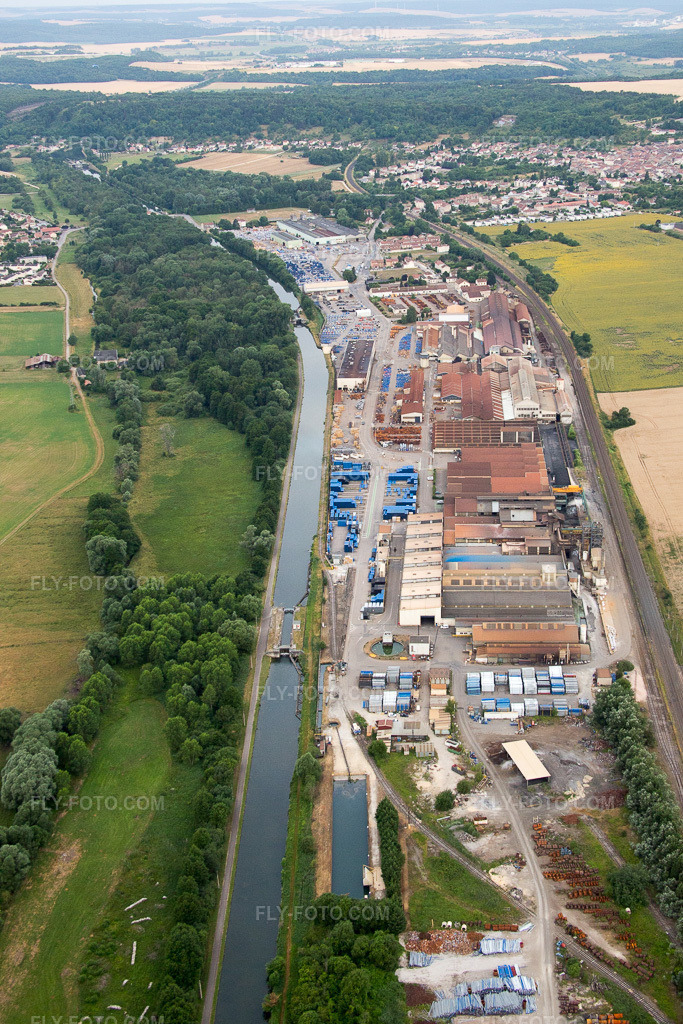 Aerial view: Saint Gobain PAM foundry site on the Canal de la Marne au Rhin in Foug in the state Meurthe et Moselle, France.Photo: IMG_083505.jpg taken on 07/13/2015 by Werner Riehm/FLY-FOTO.comResolution of the original: 3162 x 4744 px