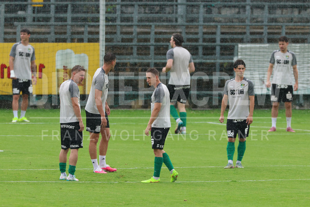 Friendly Match: SC Weiz vs TSV Hartberg in Weiz | Weiz, AUSTRIA, 01.JUL.26 - SOCCER - ADMIRAL Bundesliga, SC Weiz vs TSV Hartberg, test match. The image shows SC Weiz in heavy rain during warm up.
