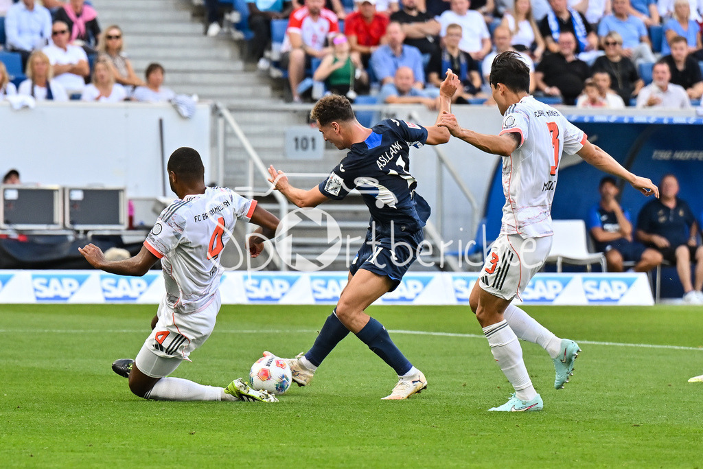 TSG 1899 Hoffenheim - FC Bayern München | v. l. Jonathan TAH (FC Bayern Muenchen 4), Fisnik ASLLANI (TSG Hoffenheim 11) und Minjae KIM (FC Bayern Muenchen 3) / Torschuss / Bundesliga: TSG 1899 Hoffenheim - FC Bayern München; PreZero-Arena am 20.09.2025 / DFL REGULATIONS PROHIBIT ANY USE OF PHOTOGRAPHS AS IMAGE SEQUENCES AND/OR QUASI-VIDEO
