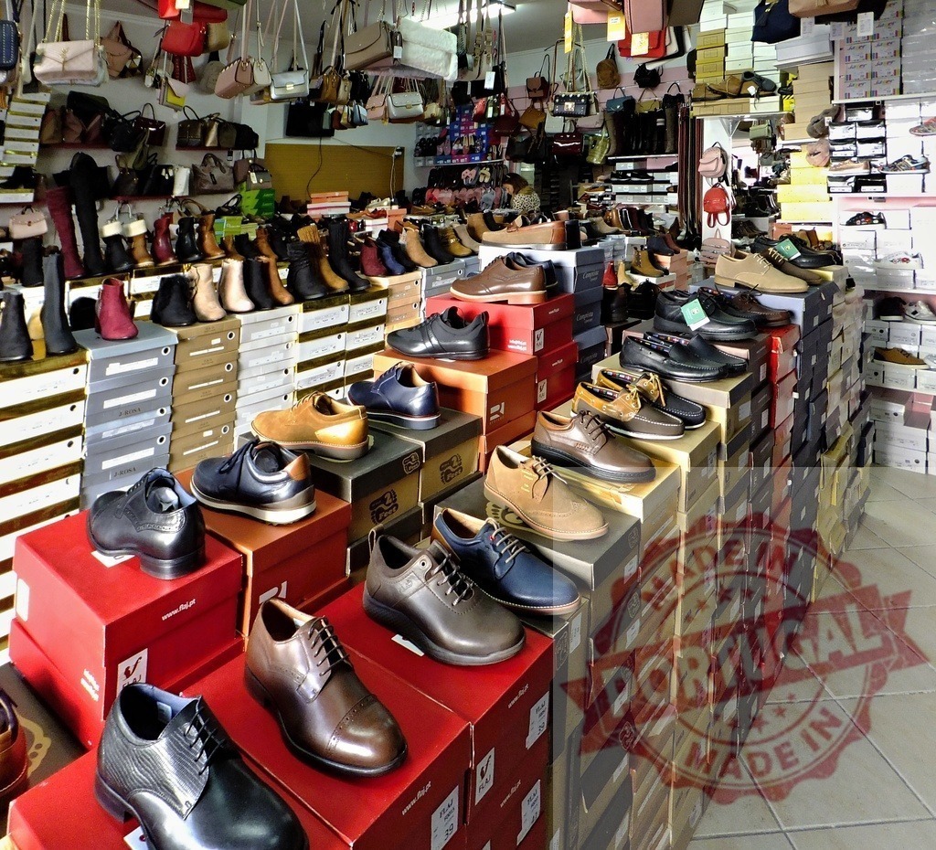 Shoe store displaying footwear and handbags for sale | Inside view of a retail shoe store selling various men's and women's footwear and fashion accessories - Realisiert mit Pictrs.com