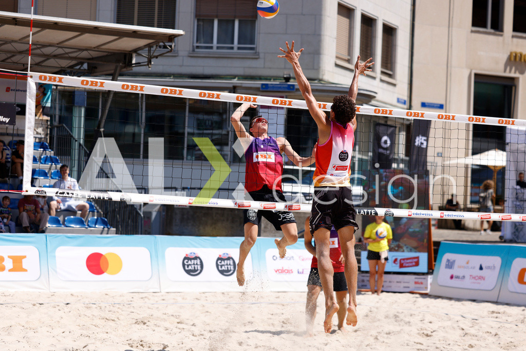 Obi BeachTour 2026 - Basel | BASEL, SWITZERLAND - JULY 18: YANN BORTOLUZZI (SUI) attack / spike against MAËL MASSEREY (SUI) block during the Obi BeachTour 2026 match between MASSEREY / SCHNEGG (SUI) and BORTOLUZZI / JAUFFRET (SUI) at Barfüsserplatz on July 18, 2026 in Basel, Switzerland. - Realisiert mit Pictrs.com